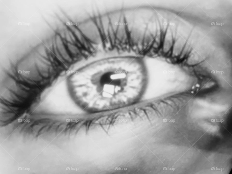 Black-and-white photo of a woman’s eye 