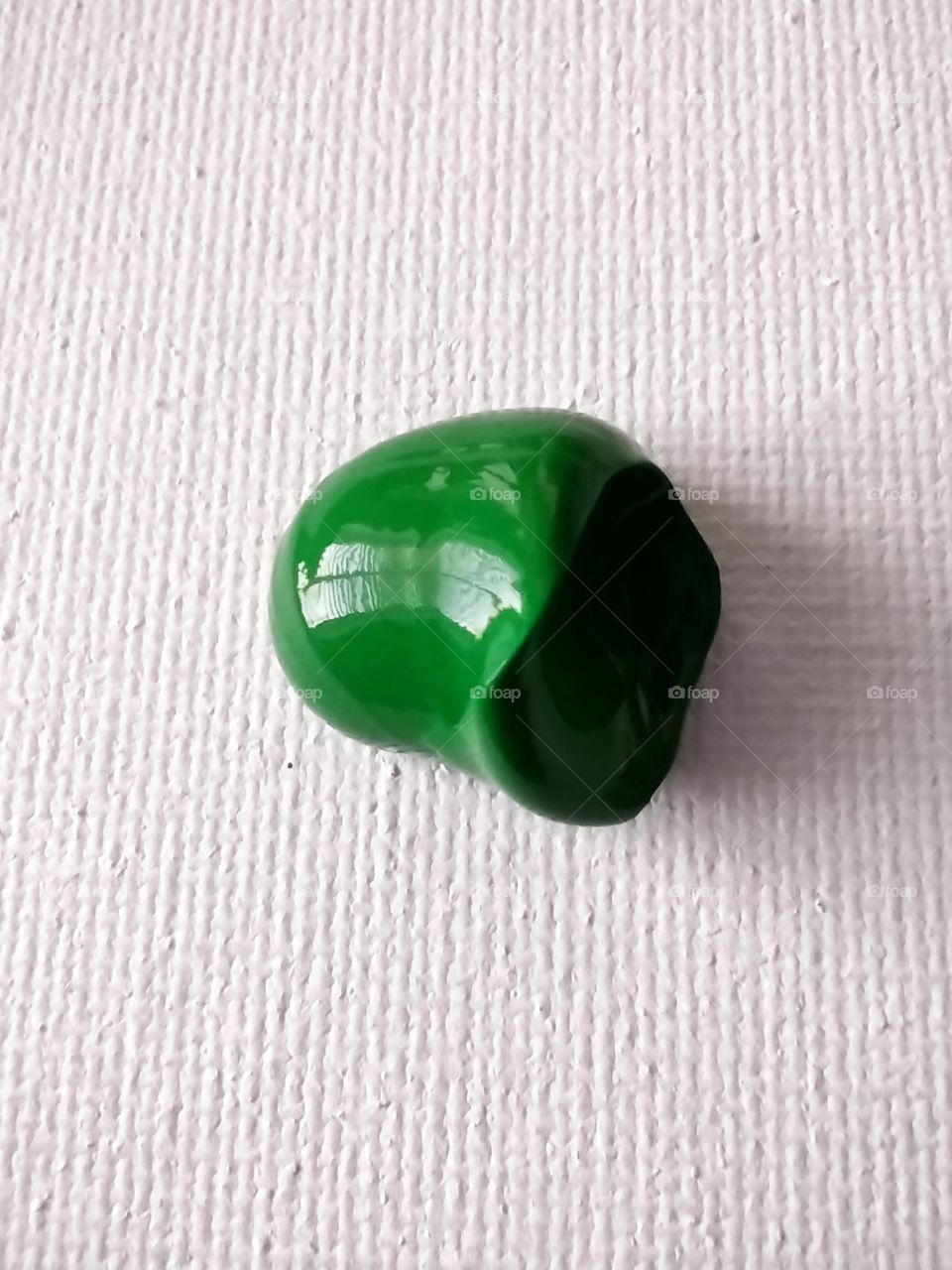 Unfiltered, beautiful, lovely close-up of green paint on a canvas