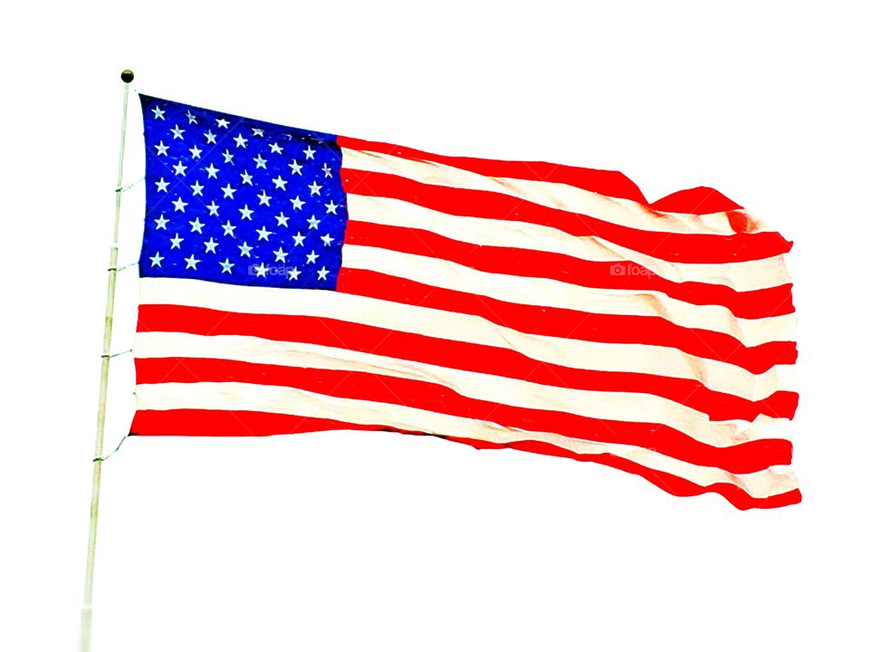Beautiful big American Flag blowing in the wind.