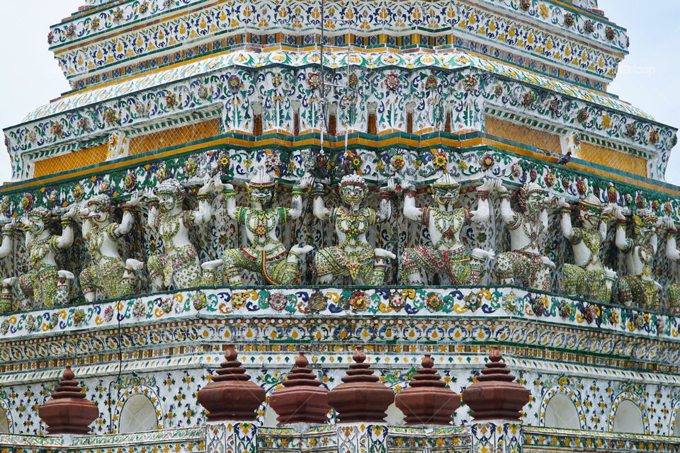 details od the wall of wat arun temple in bangkok thailand