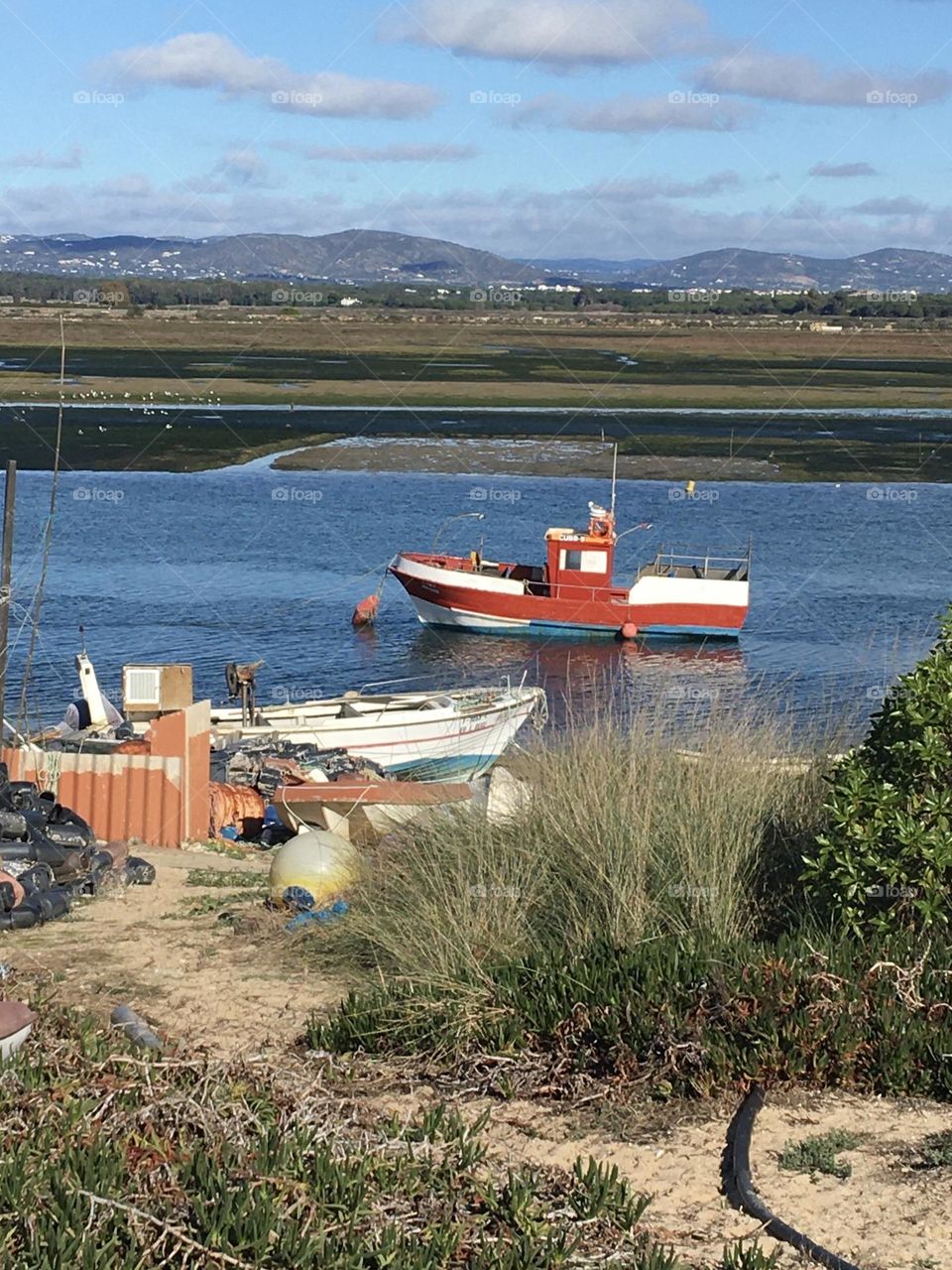 Boats on Ria Formosa at low tide 