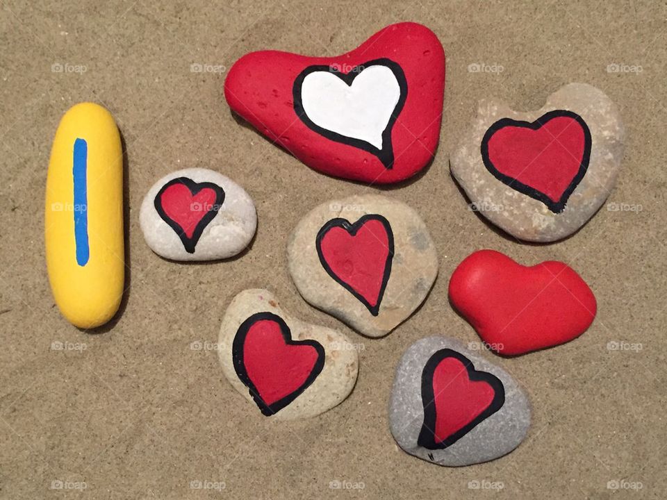 I love, conceptual stone colored hearts on the sand