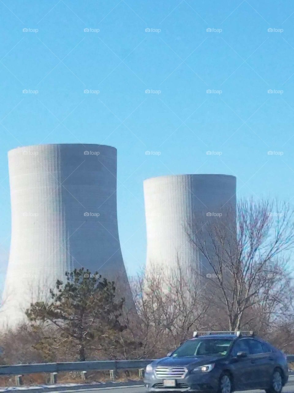Nuclear power plant Cooling Towers seen from highway, two of them.