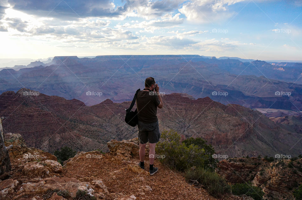 Man making a picture of the Grand Canyon
