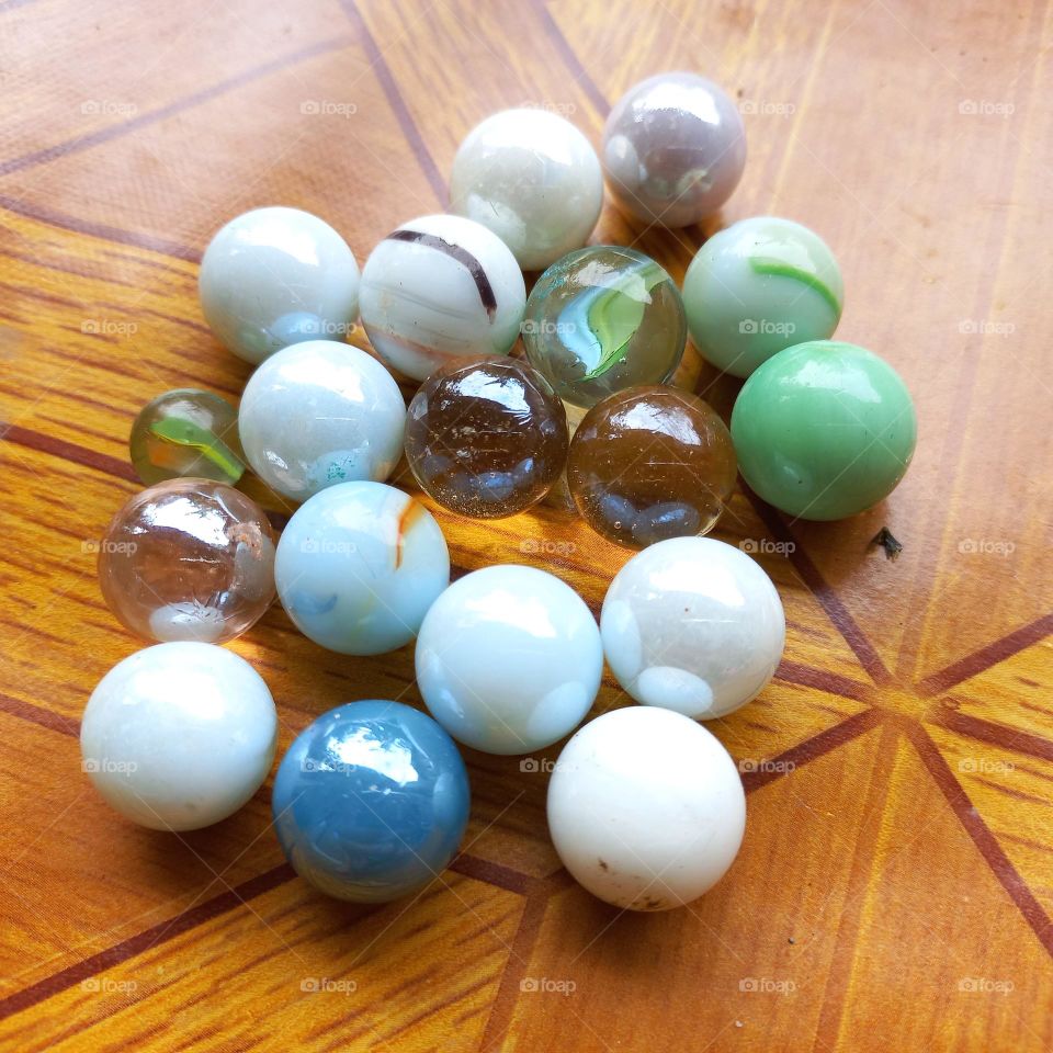Small balls made of marble or glass clay for children's games