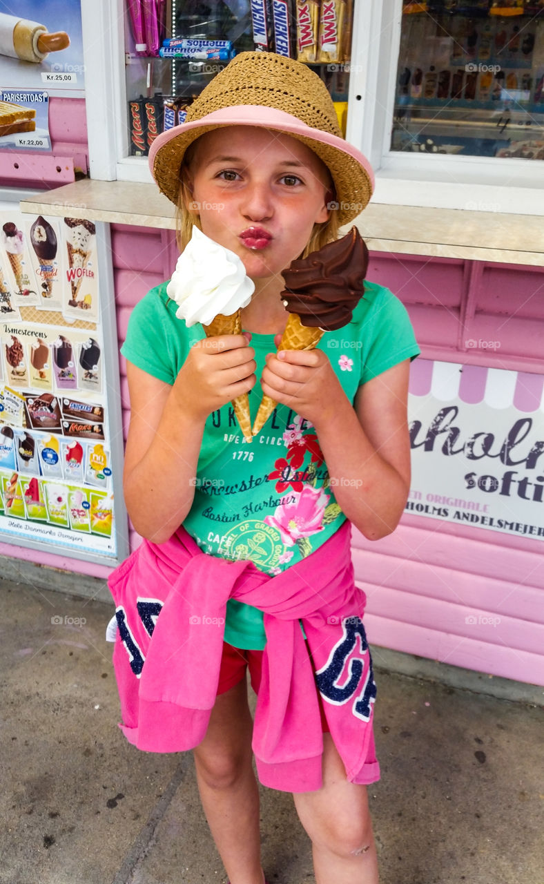 sweet little girl with two big icecream cones