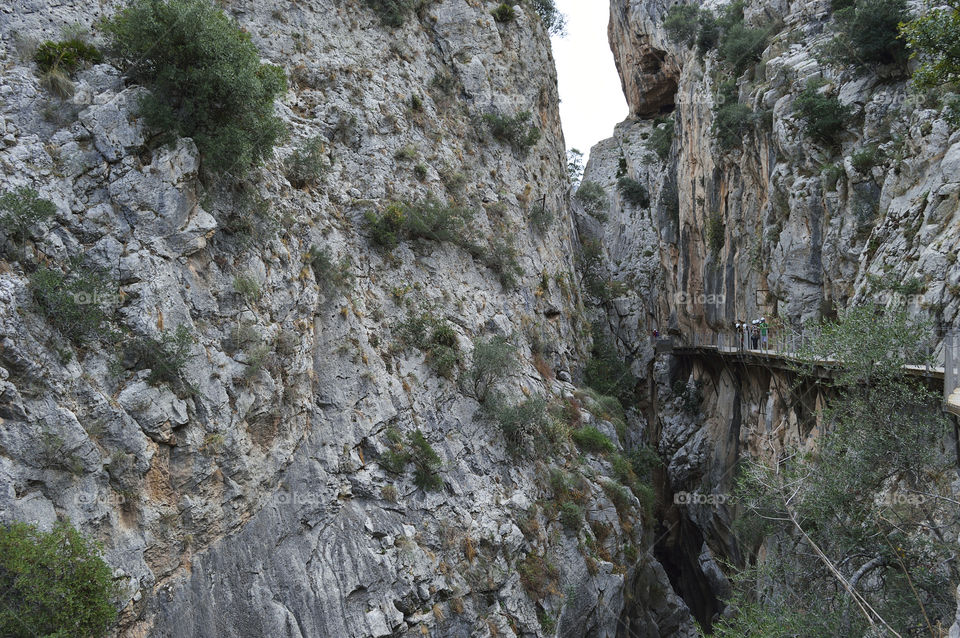 El Caminito del Rey is a passage built on the walls of the Gaitanes gorge, between the municipalities of Ardales, Álora and Antequera, in the province of Málaga, autonomous community of Andalucía, Spain. It is a pedestrian walkway of more than 3 kilometers (in addition to 4.8 kilometers of access), attached to the rock inside a canyon, with sections of a width of just 1 meter, hanging up to 105 meters high above the river, in almost vertical walls