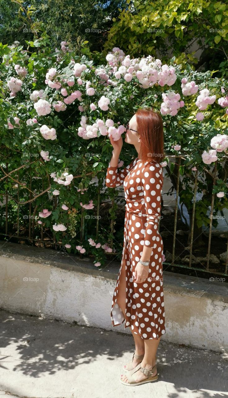 Woman in a dress with white polka-dot.