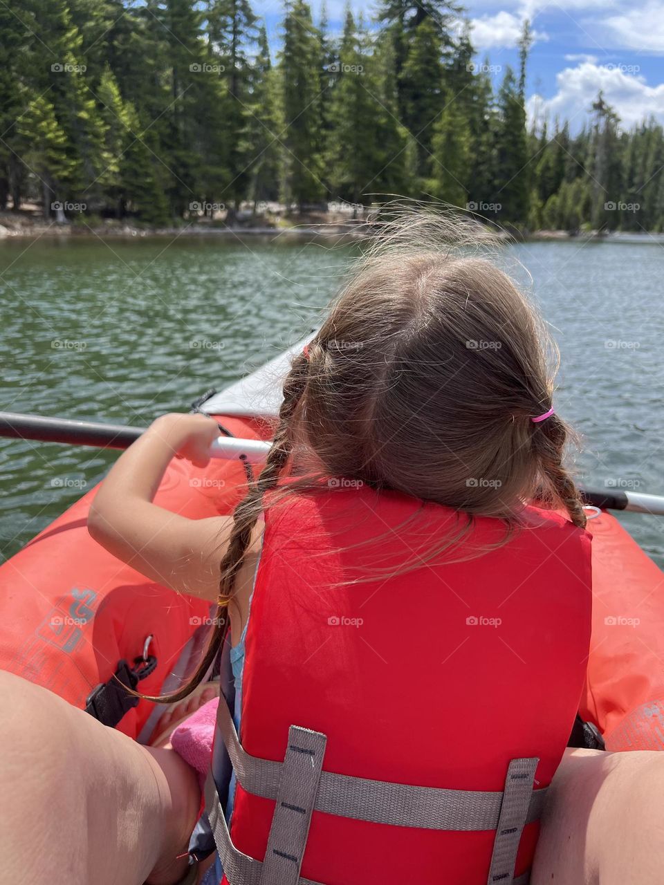 Kids kayaking on the lake 