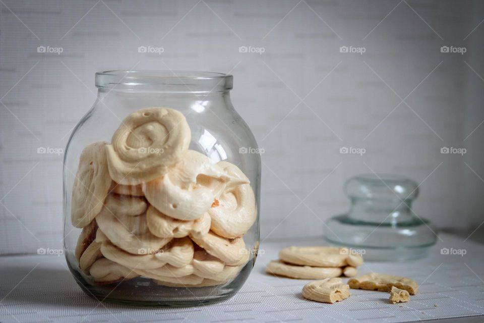 Homemade meringues in cookie jar