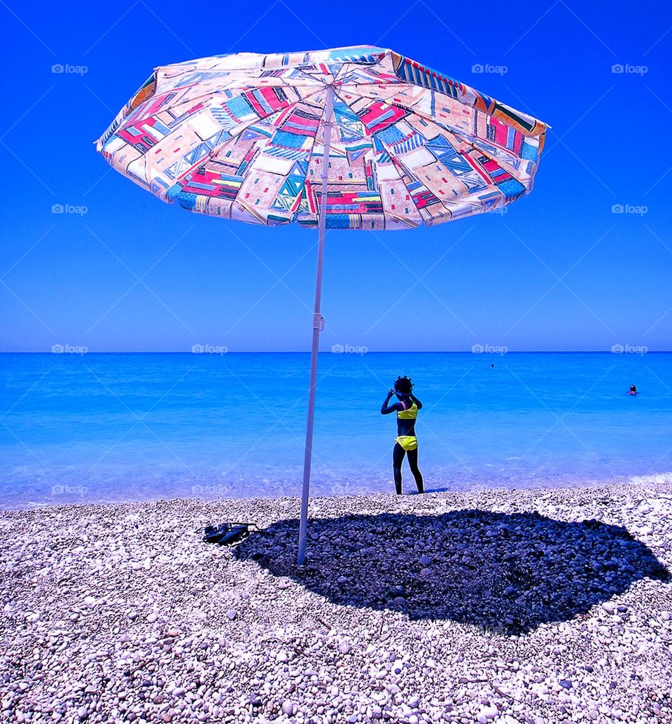 Girl alone in blue lagoon beach summer holidays seascape wildlife beautiful nature therapy amazing place to be free yourself Lefkafa exploring Greece