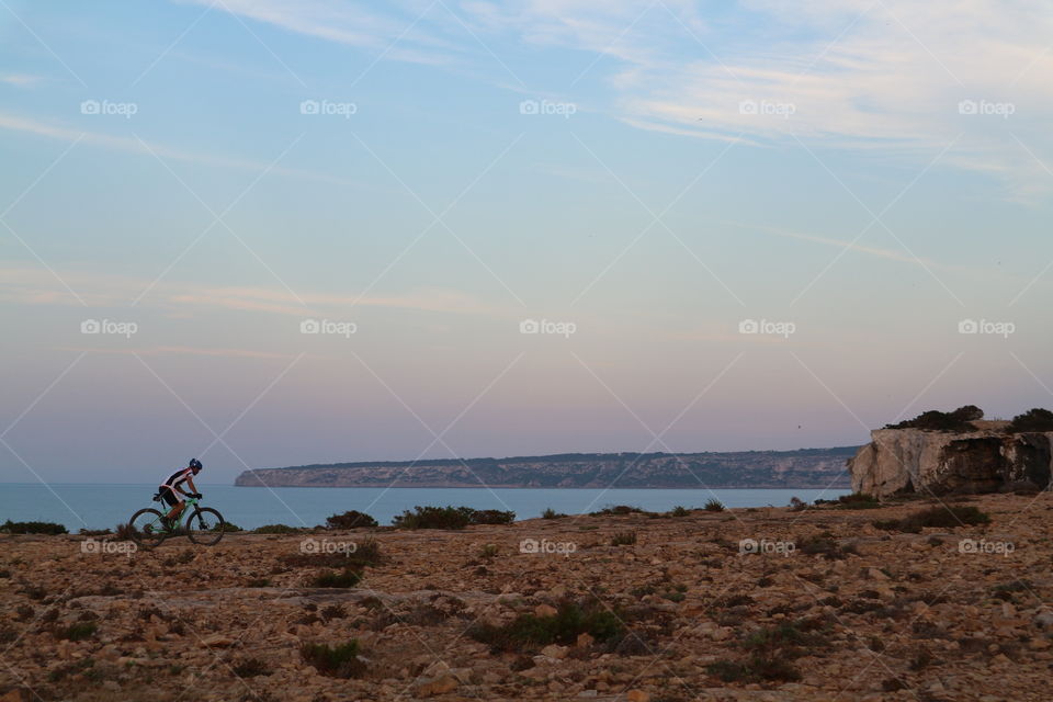 biker on zhe cliff