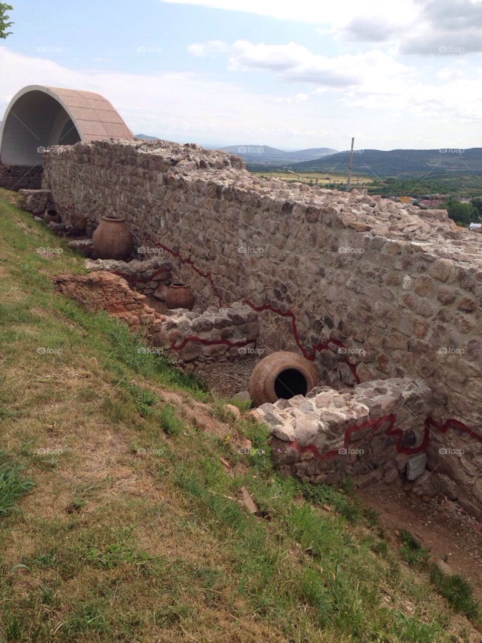 Wall and artifacts in Peristera fortress  in Bulgaria - Ancient and Medieval archaeological monument in Peshtera, Bulgaria.