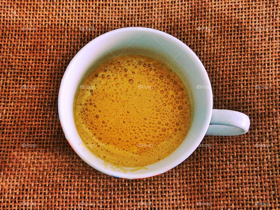 High angle view of coffee cup on table