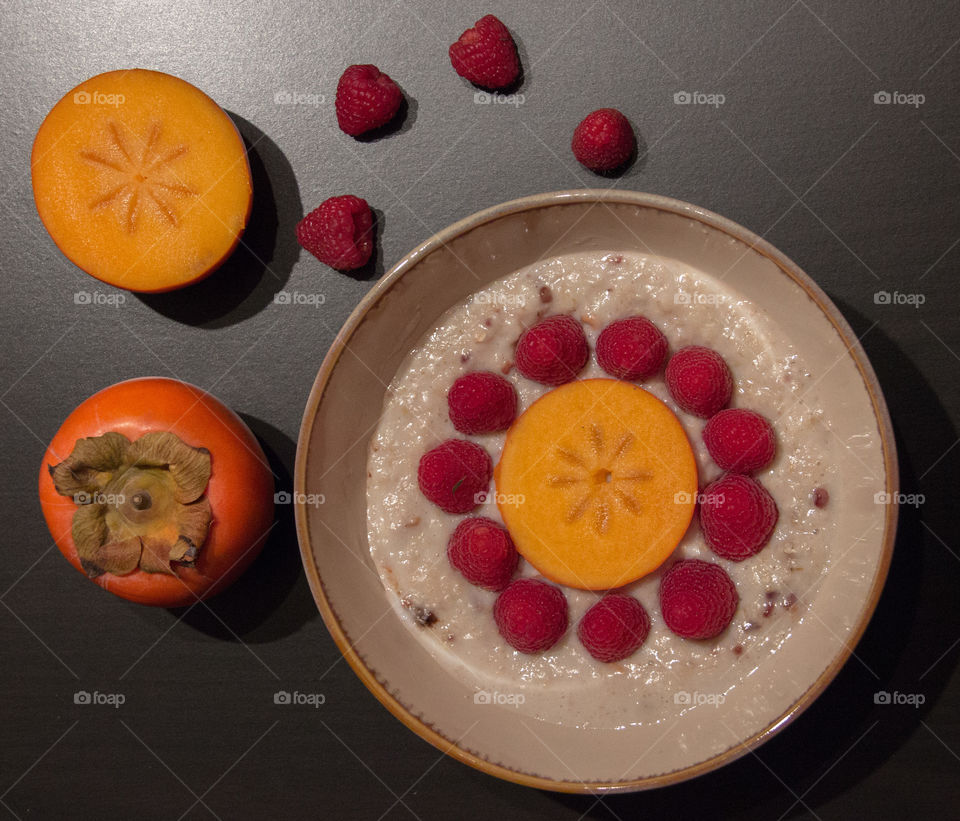 Persimmon and raspberry oatmeal