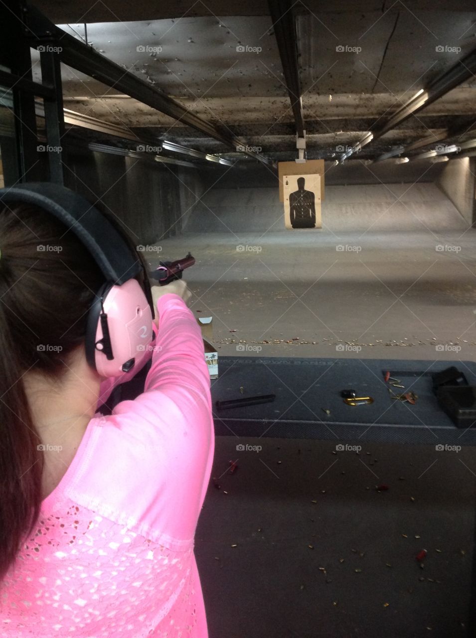 Girls with Guns. Woman at the shooting range