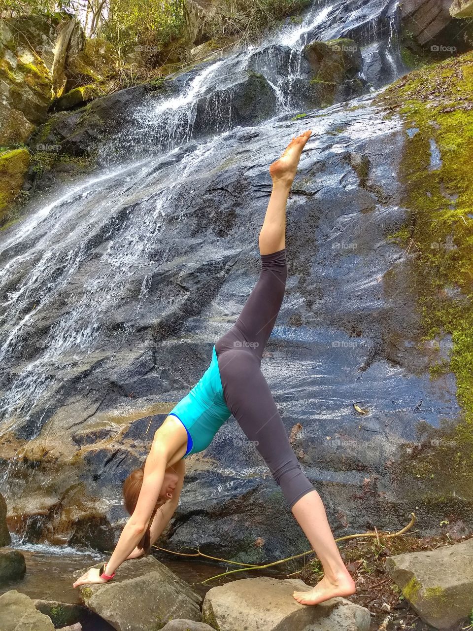 yoga pose by waterfall