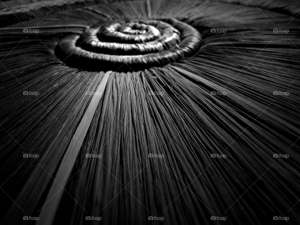 Tight radial and spiral patterns in handwoven East African basket art