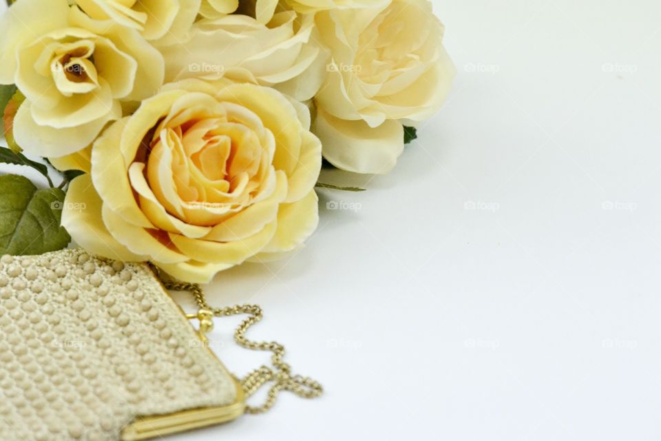 Vintage clutch and yellow flowers