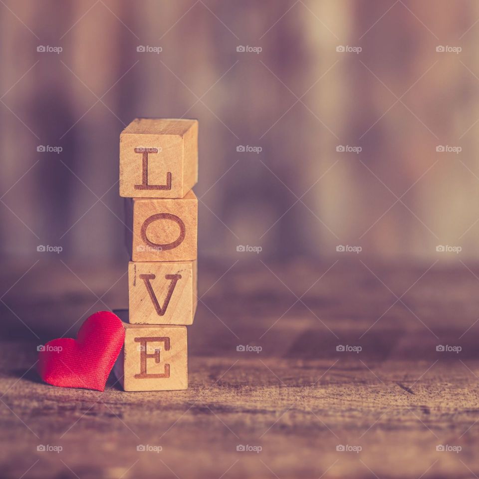 wooden cube labeled love