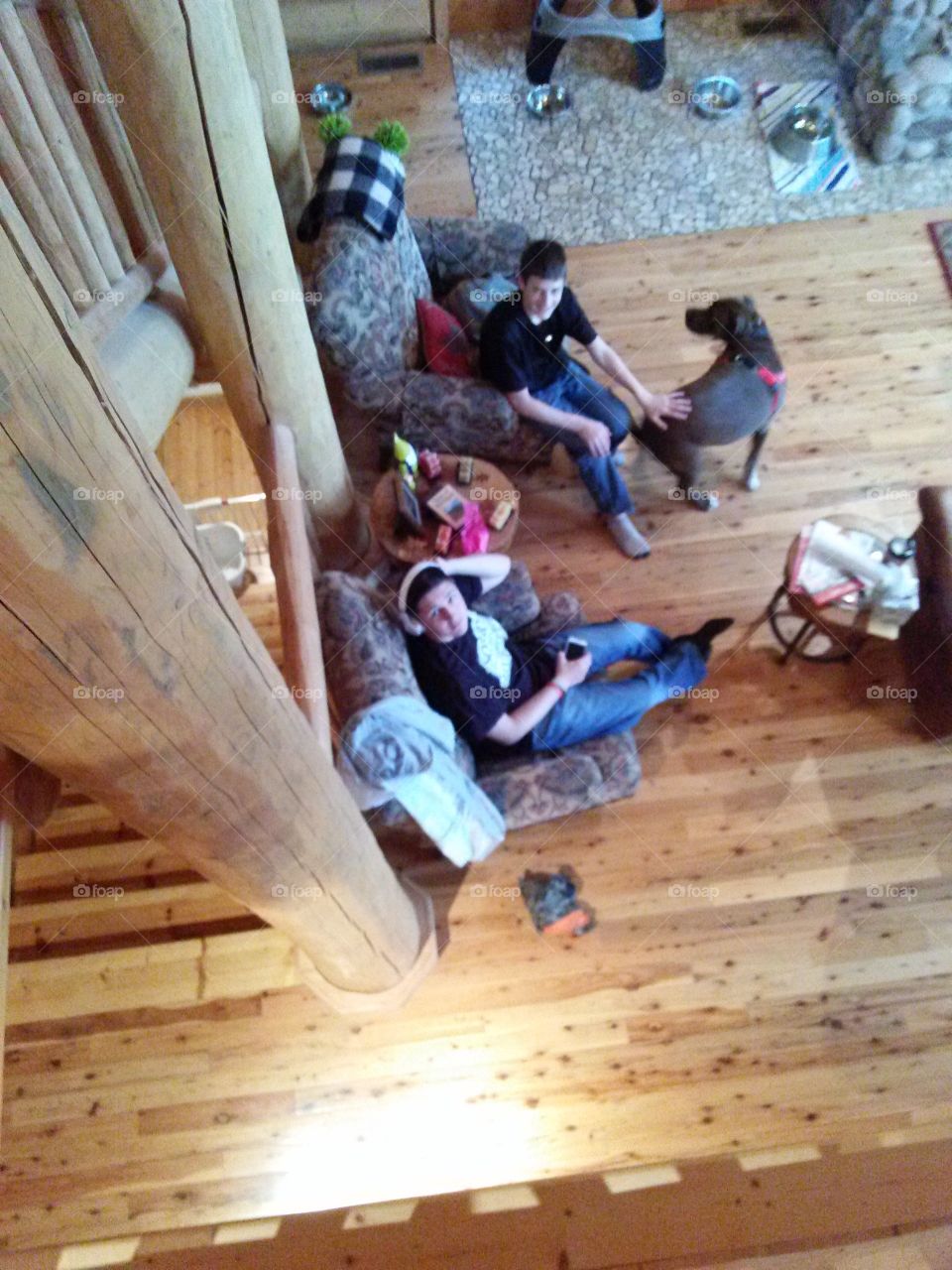 Things are Looking Up. People, sitting far below in a log home