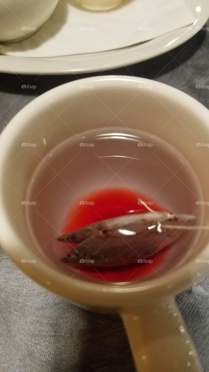 wild berry tea seeping into water, getting ready to sooth the soul.