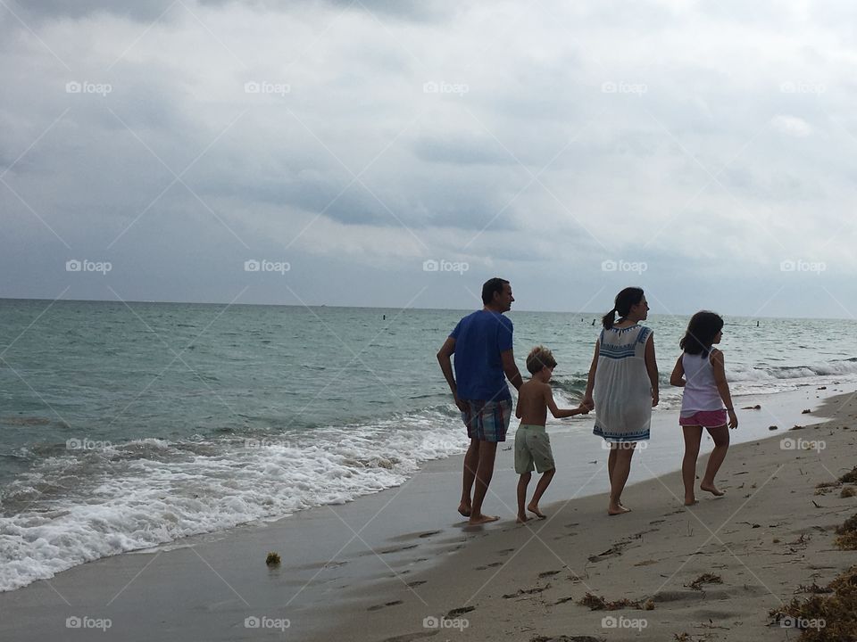 Walking in beach with family