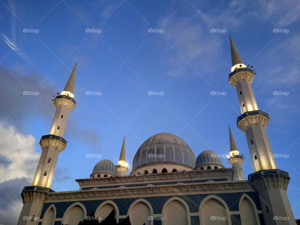 The mosque with lights in the blue.