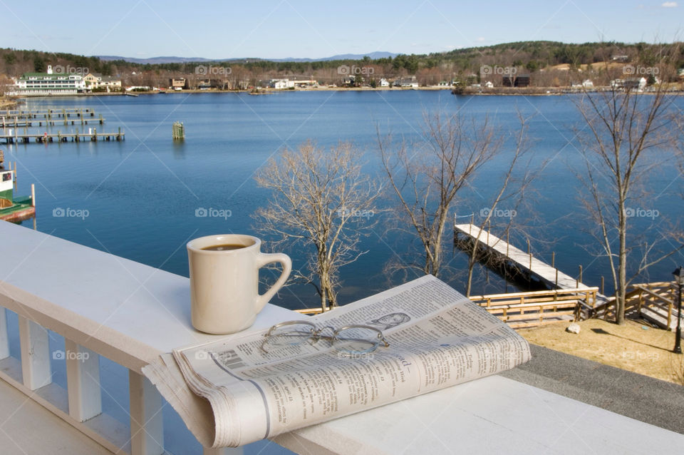 Reading the news with coffee on the deck