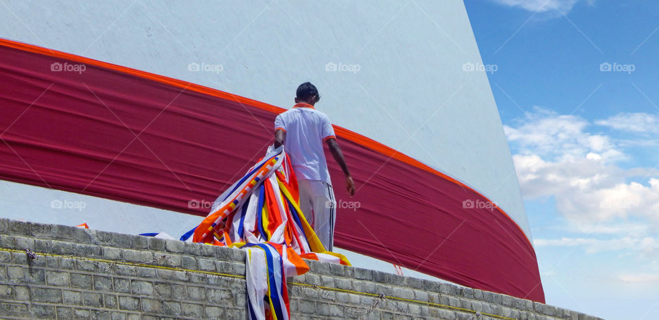 Man with Buddhist flag -Anuradhapuraya - Sri Lanka