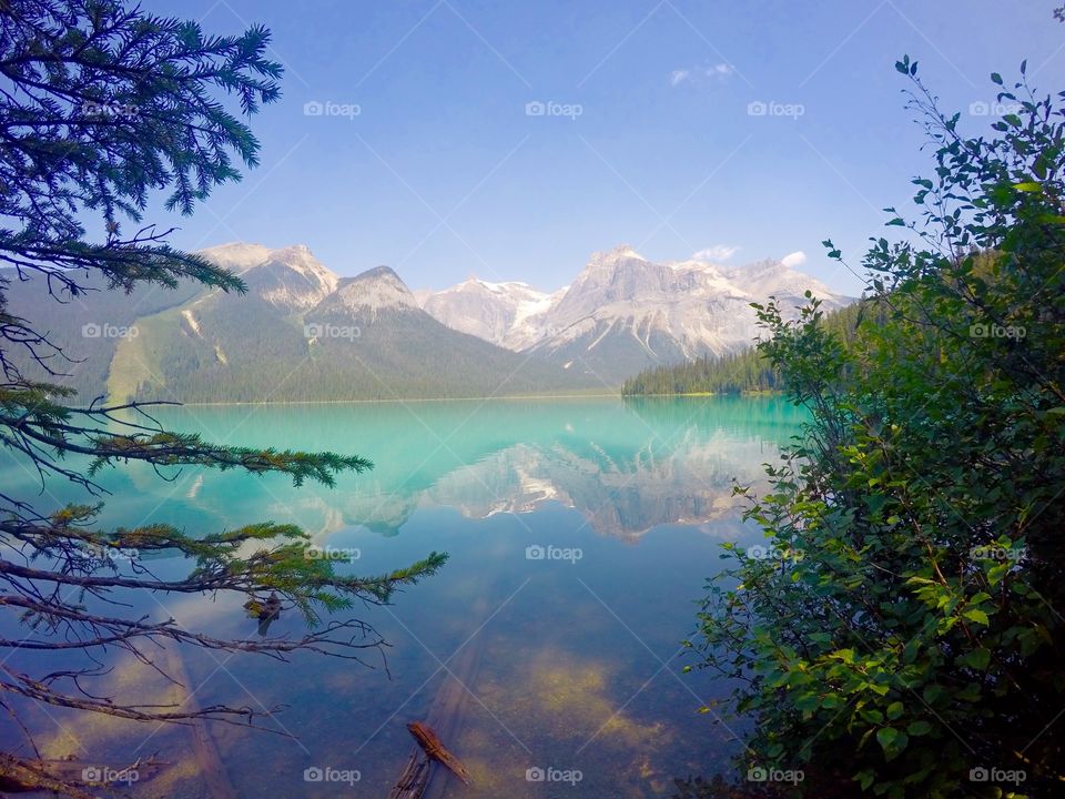 Snowy mountain reflected in lake