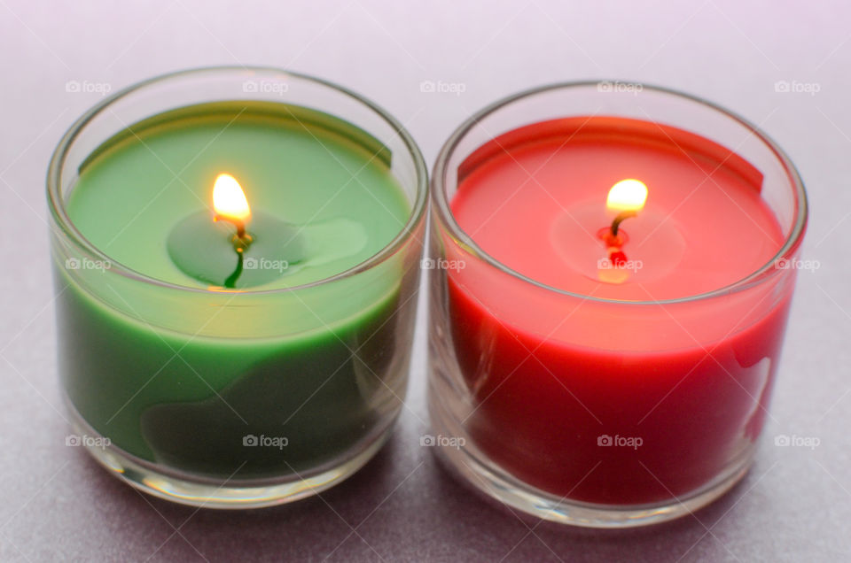 red and green candle on purple background