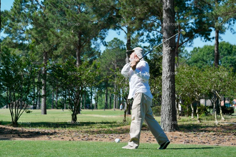 Man playing golf