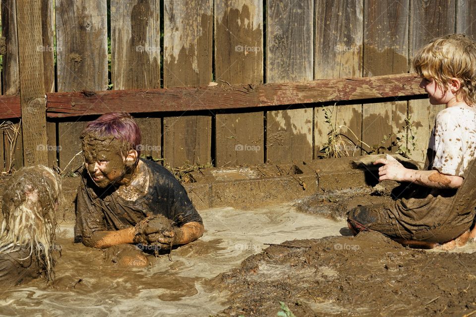 Boys Playing In Mud
