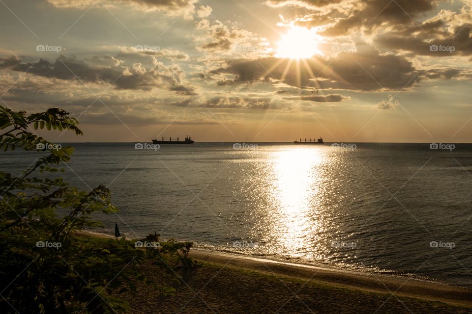 Beautiful sunrise and sun beam over the sea