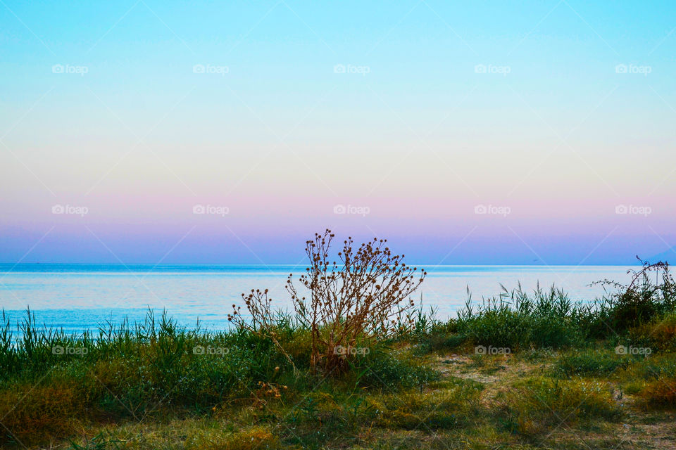 Panoramic seaview of the sunset in pastel colors from Golden Beach in Thassos Greece